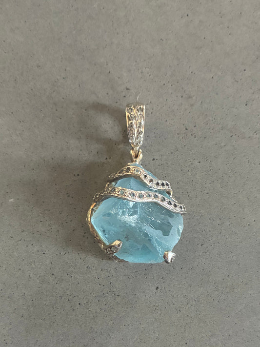 Blue Topaz Claw Pendant